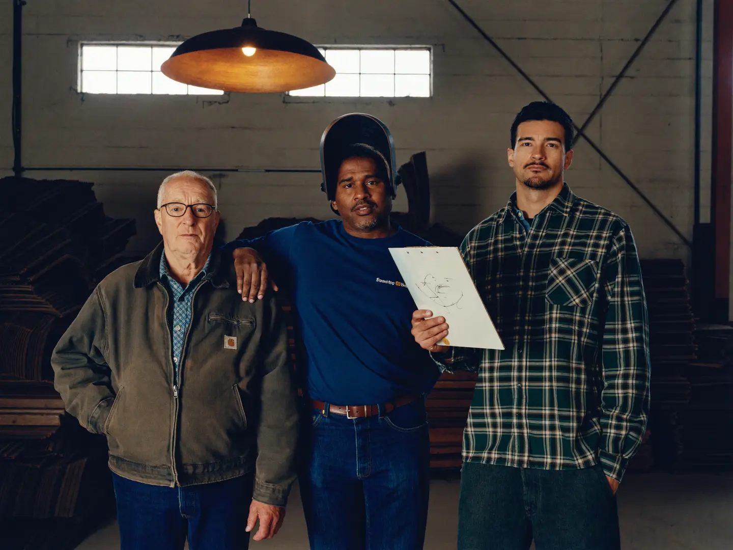 Three generations of Ironhold fabricators standing in the yard